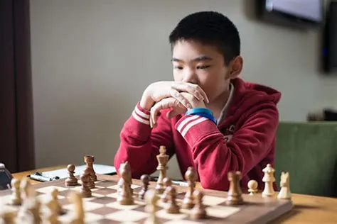 Who was the chinese grandmaster at 14?