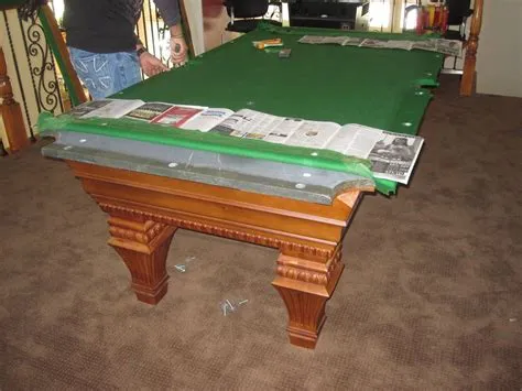 How heavy is a 1 piece slate pool table?