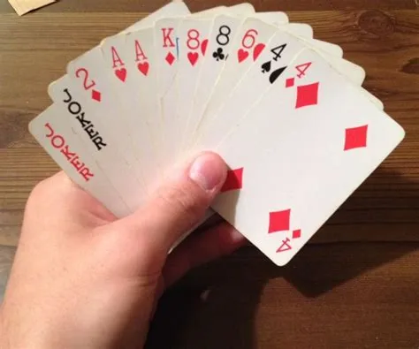 How do you play canasta with 4 players?