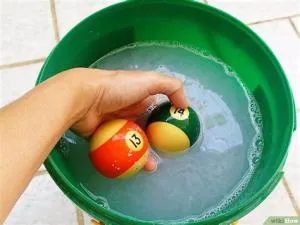 Can you clean pool balls with water?