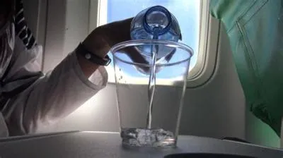 Should i drink water before a flight?