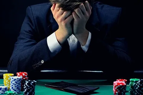 What are three signs that someone may have a gambling problem?