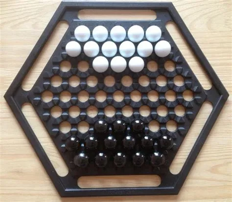 What is the board game with black and white balls?