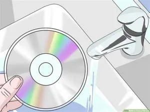 Is it okay to clean a game disc with water?